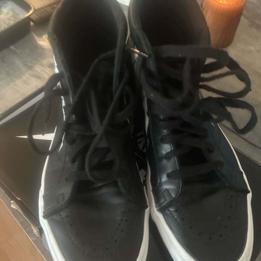 Vans Men's Black and White High-Top Sneakers